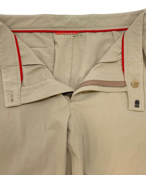 PRADA SPORTS（プラダスポーツ）PRADA SPORTS (プラダスポーツ) 裾ジップストレッチパンツ ベージュ サイズ:SIZE 48の古着・服飾アイテム