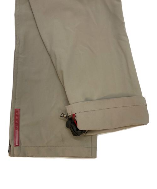 PRADA SPORTS（プラダスポーツ）PRADA SPORTS (プラダスポーツ) 裾ジップストレッチパンツ ベージュ サイズ:SIZE 48の古着・服飾アイテム
