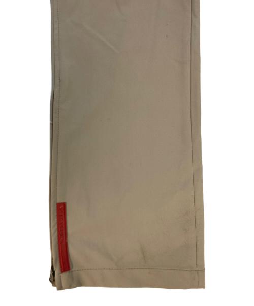 PRADA SPORTS（プラダスポーツ）PRADA SPORTS (プラダスポーツ) 裾ジップストレッチパンツ ベージュ サイズ:SIZE 48の古着・服飾アイテム
