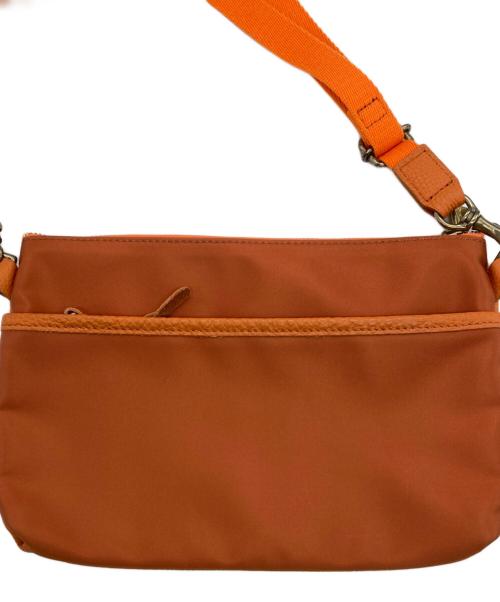 Magnu（マヌー）magnu (マヌー) ショルダーバッグ オレンジの古着・服飾アイテム