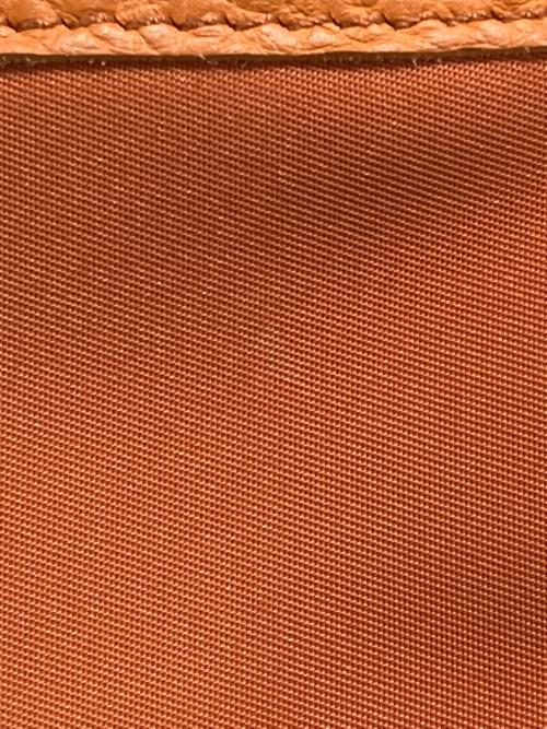 Magnu（マヌー）magnu (マヌー) ショルダーバッグ オレンジの古着・服飾アイテム