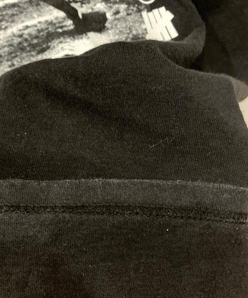 stussy（ステューシー）stussy (ステューシー) UNDEFEATED (アンディフィーテッド) 00’ｓコラボプリントＴシャツ ブラック サイズ:XLの古着・服飾アイテム