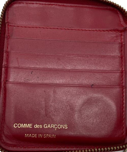 COMME des GARCONS（コムデギャルソン）COMME des GARCONS (コムデギャルソン) クローバー柄ラウンドジップウォレット レッドの古着・服飾アイテム