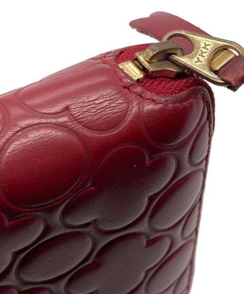 COMME des GARCONS（コムデギャルソン）COMME des GARCONS (コムデギャルソン) クローバー柄ラウンドジップウォレット レッドの古着・服飾アイテム