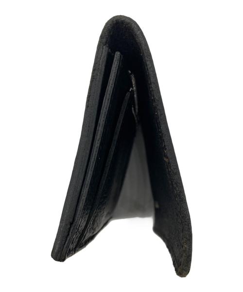 ISAMU KATAYAMA BACKLASH（イサムカタヤマ・バックラッシュ）ISAMU KATAYAMA BACKLASH (イサムカタヤマ・バックラッシュ) 2つ折り財布 ブラックの古着・服飾アイテム