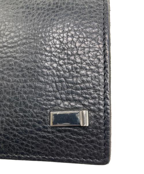 ISAMU KATAYAMA BACKLASH（イサムカタヤマ・バックラッシュ）ISAMU KATAYAMA BACKLASH (イサムカタヤマ・バックラッシュ) 2つ折り財布 ブラックの古着・服飾アイテム