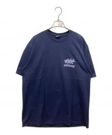 stussy（ステューシー）の古着「サーフマン プリントTシャツ」｜ネイビー