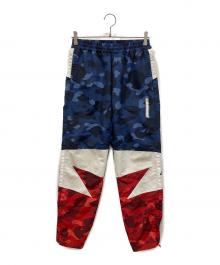 A BATHING APE（アベイシングエイプ）の古着「COLOR CAMO BAPESTA TRACK PANTS」｜ネイビー
