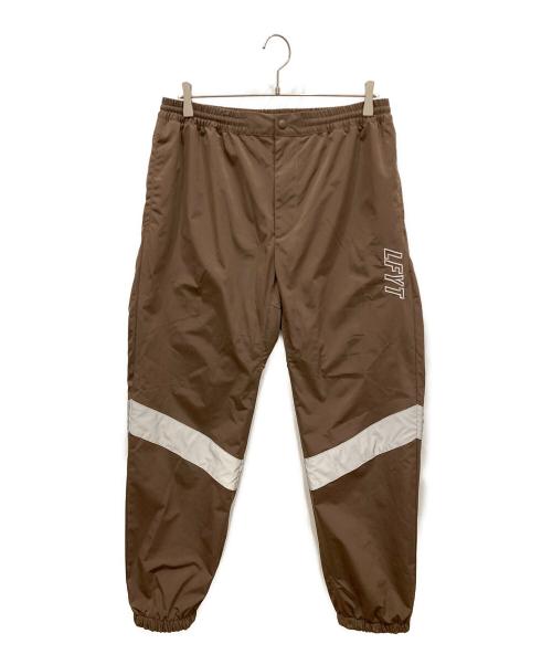 LFYT（エルエフワイティー）LFYT (エルエフワイティー) REFLECTOR TRACK PANTS ブラウン サイズ:SIZE Lの古着・服飾アイテム