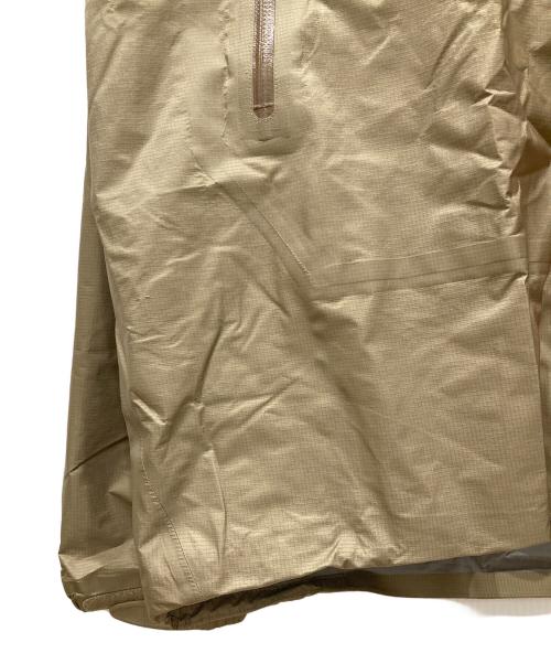 mont-bell（モンベル）mont-bell (モンベル) ストームクルーザー ジャケット ベージュ×オレンジ サイズ:SIZE XLの古着・服飾アイテム