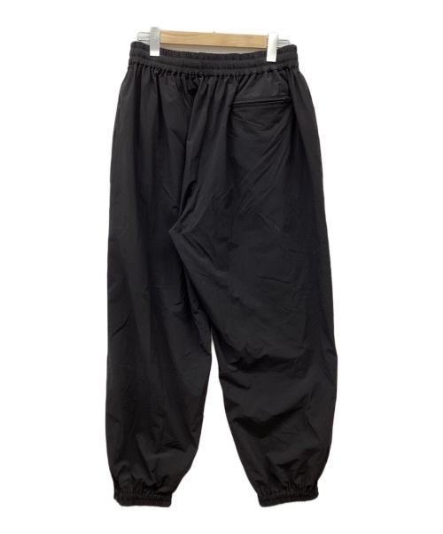 COOTIE PRODUCTIONS（クーティープロダクツ）COOTIE PRODUCTIONS (クーティープロダクツ) Nylon Light Cloth Wide Training Pants/ナイロンクロスワイドトレーニングパンツ/ナイロンパンツ ブラック サイズ:Lの古着・服飾アイテム
