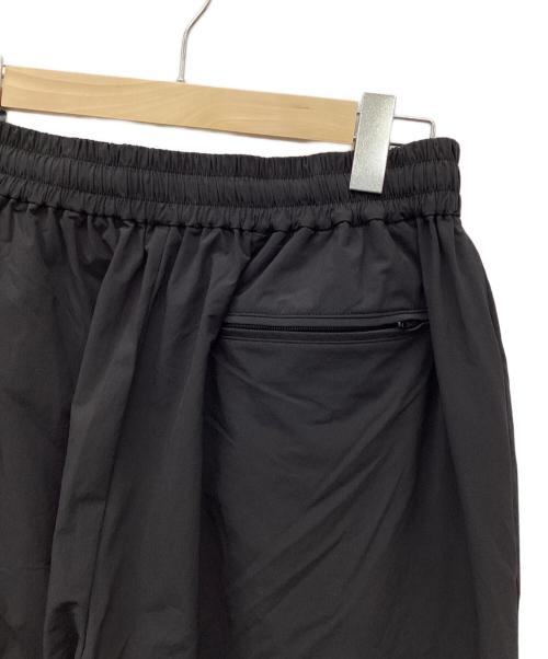 COOTIE PRODUCTIONS（クーティープロダクツ）COOTIE PRODUCTIONS (クーティープロダクツ) Nylon Light Cloth Wide Training Pants/ナイロンクロスワイドトレーニングパンツ/ナイロンパンツ ブラック サイズ:Lの古着・服飾アイテム