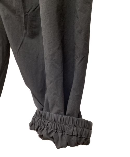COOTIE PRODUCTIONS（クーティープロダクツ）COOTIE PRODUCTIONS (クーティープロダクツ) Nylon Light Cloth Wide Training Pants/ナイロンクロスワイドトレーニングパンツ/ナイロンパンツ ブラック サイズ:Lの古着・服飾アイテム