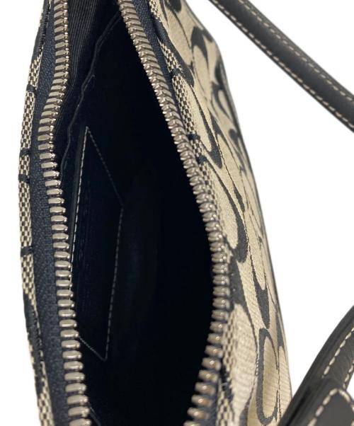 COACH（コーチ）COACH (コーチ) シグネチャーハンドポーチ ベージュ×ブラックの古着・服飾アイテム