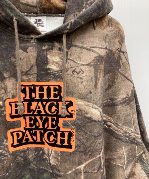 THE BLACK EYE PATCH（ブラックアイパッチ）THE BLACK EYE PATCH (ブラックアイパッチ) OG LABEL SAFETY REAL TREE CAMO HOODIE ベージュ サイズ:XLの古着・服飾アイテム