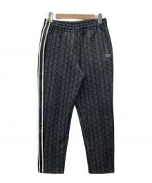 LACOSTE（ラコステ）の古着「サイドテーピングモノグラムジャカードトラックパンツ」｜グレー