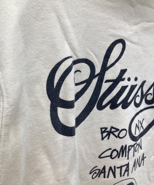 stussy（ステューシー）stussy (ステューシー) WORLD TOUR ZIP HOOD/ワールドツアージップパーカージップパーカー ベージュ サイズ:Lの古着・服飾アイテム