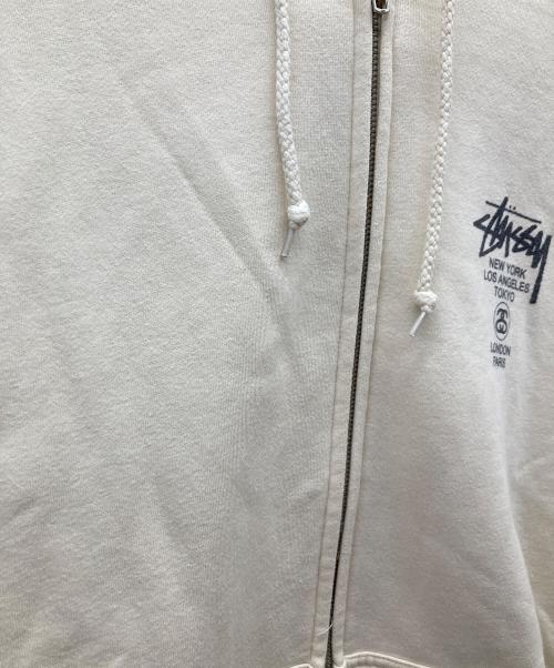 stussy（ステューシー）stussy (ステューシー) WORLD TOUR ZIP HOOD/ワールドツアージップパーカージップパーカー ベージュ サイズ:Lの古着・服飾アイテム