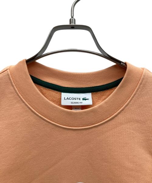 LACOSTE（ラコステ）LACOSTE (ラコステ) ビッグクロックカレッジロゴクルーネックスウェット オレンジ サイズ:L 未使用品の古着・服飾アイテム