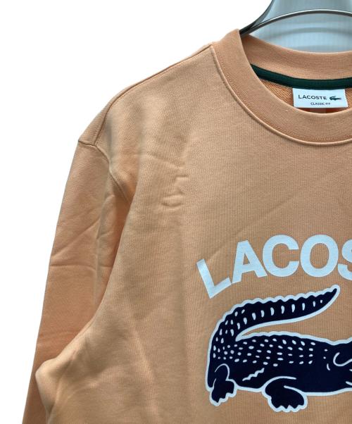 LACOSTE（ラコステ）LACOSTE (ラコステ) ビッグクロックカレッジロゴクルーネックスウェット オレンジ サイズ:L 未使用品の古着・服飾アイテム