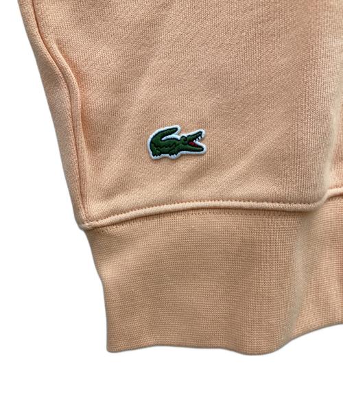 LACOSTE（ラコステ）LACOSTE (ラコステ) ビッグクロックカレッジロゴクルーネックスウェット オレンジ サイズ:L 未使用品の古着・服飾アイテム