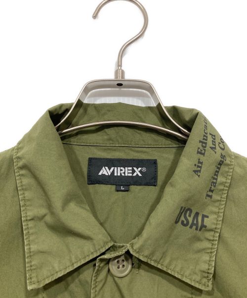 AVIREX（アヴィレックス）AVIREX (アヴィレックス) US NAVY グラフィックプリント ファティーグシャツ オリーブ サイズ:Lの古着・服飾アイテム