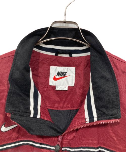 NIKE（ナイキ）NIKE (ナイキ) スウッシュ刺繍 ヴィンテージロングジャケット レッド サイズ:XLの古着・服飾アイテム