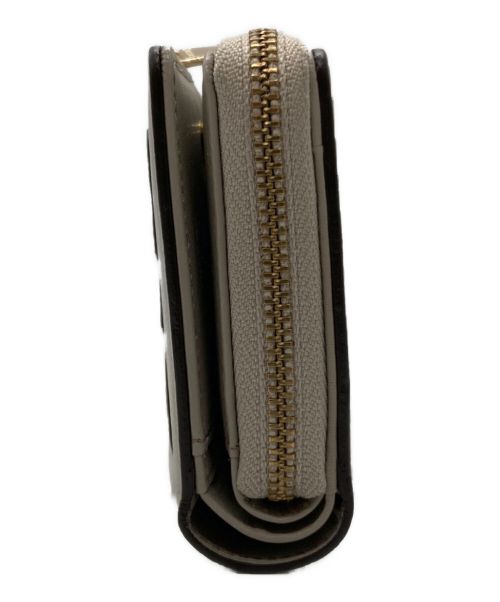 russet（ラシット）russet (ラシット) 2つ折り財布 / レザーモチーフハーフウォレット ベージュの古着・服飾アイテム