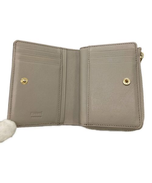 russet（ラシット）russet (ラシット) 2つ折り財布 / レザーモチーフハーフウォレット ベージュの古着・服飾アイテム