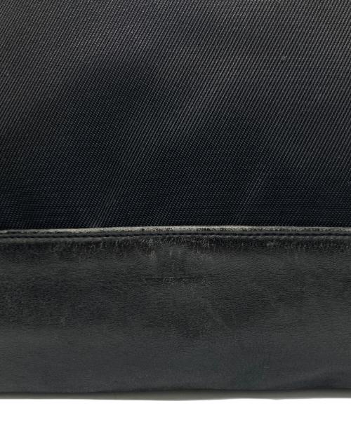 ISSEY MIYAKE（イッセイミヤケ）ISSEY MIYAKE (イッセイミヤケ) レザーナイロン巾着バッグ ブラックの古着・服飾アイテム