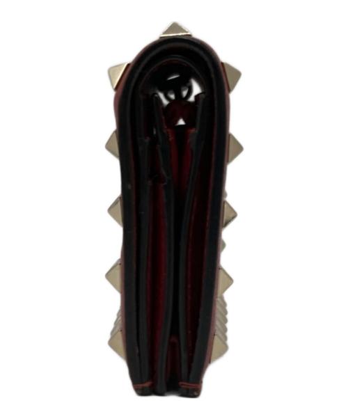 VALENTINO GARAVANI（ヴァレンティノ・ガラヴァーニ）VALENTINO GARAVANI (ヴァレンティノ・ガラヴァーニ) スタッズ2つ折り財布 レッドの古着・服飾アイテム