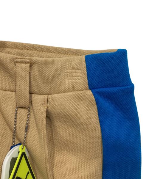 PUMA（プーマ）PUMA (プーマ) ADER error (アーダーエラー) T7 オーバーレイ ウィメンズ パンツ ベージュ サイズ:Ｍの古着・服飾アイテム