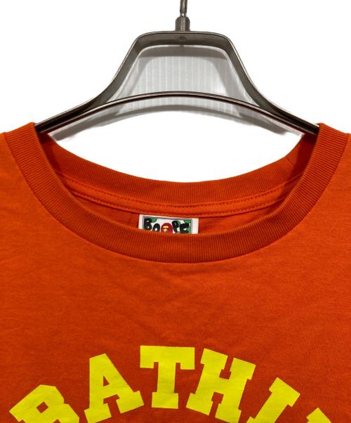 A BATHING APE（アベイシングエイプ）A BATHING APE (アベイシングエイプ) ロゴプリントTシャツ オレンジ サイズ:Lの古着・服飾アイテム