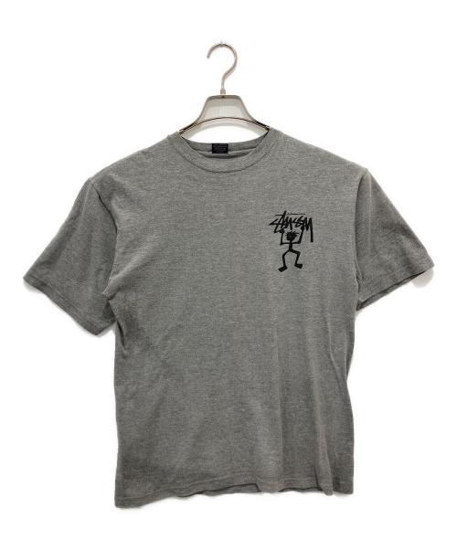 stussy（ステューシー）stussy (ステューシー) シャドーマンTシャツ/USA製/紺タグ/OLDSTUSSY グレー サイズ:Mの古着・服飾アイテム