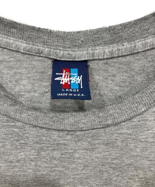 stussy（ステューシー）stussy (ステューシー) シャドーマンゴルフ プリントTシャツ グレー サイズ:Lの古着・服飾アイテム