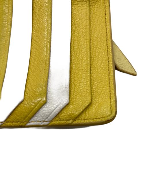 MIU MIU（ミュウミュウ）MIU MIU (ミュウミュウ) マドラス フラグメントケース イエローの古着・服飾アイテム