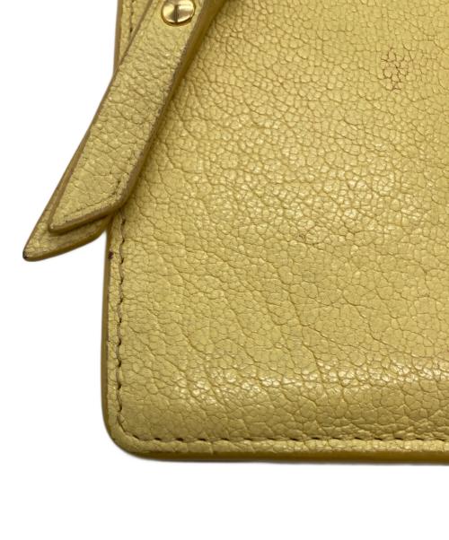 MIU MIU（ミュウミュウ）MIU MIU (ミュウミュウ) マドラス フラグメントケース イエローの古着・服飾アイテム