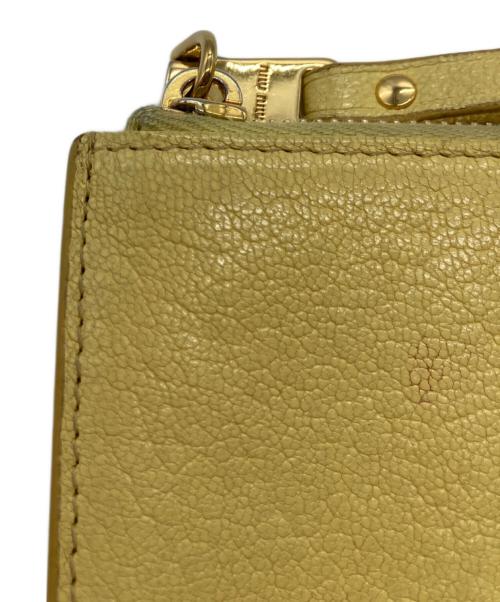 MIU MIU（ミュウミュウ）MIU MIU (ミュウミュウ) マドラス フラグメントケース イエローの古着・服飾アイテム