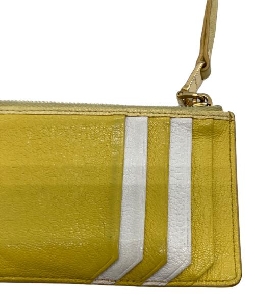 MIU MIU（ミュウミュウ）MIU MIU (ミュウミュウ) マドラス フラグメントケース イエローの古着・服飾アイテム