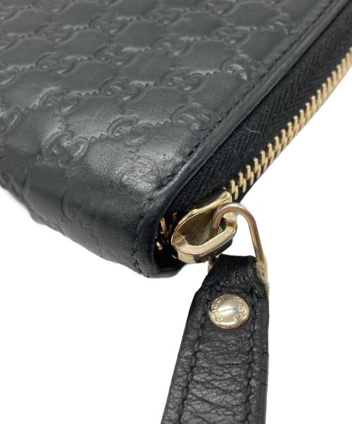 GUCCI（グッチ）GUCCI (グッチ) マイクログッチシマ レザー ラウンドジップウォレット ブラックの古着・服飾アイテム