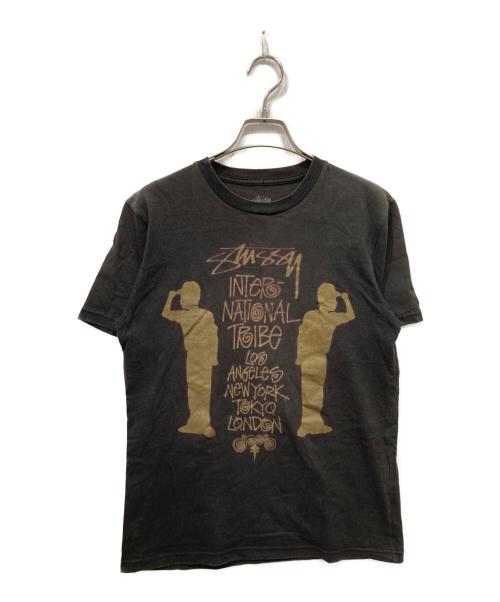stussy（ステューシー）stussy (ステューシー) シャドーマンツアープリントTシャツ ブラック サイズ:Sの古着・服飾アイテム