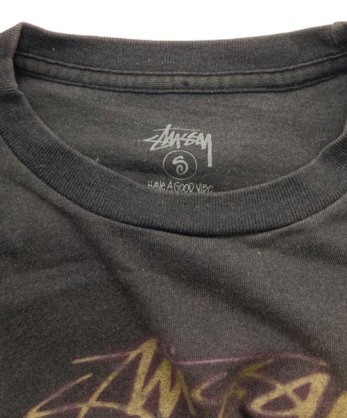 stussy（ステューシー）stussy (ステューシー) シャドーマンツアープリントTシャツ ブラック サイズ:Sの古着・服飾アイテム
