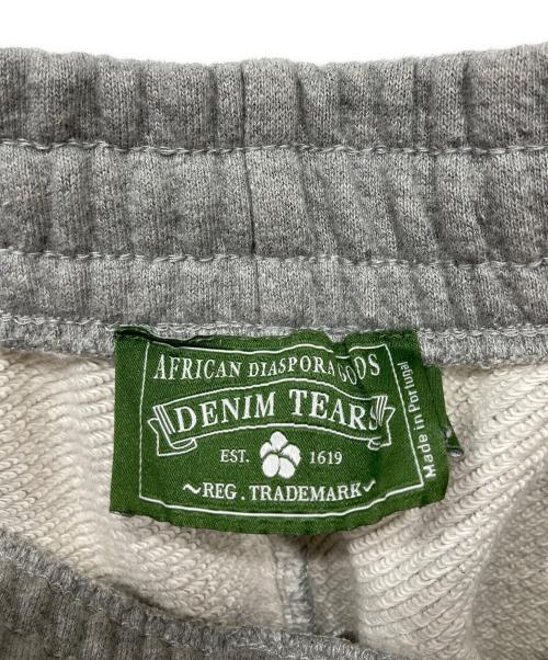 Denim Tears（デニムティアーズ）Denim Tears (デニムティアーズ) Cotton Wreath ドローストリング トラックパンツ グレー サイズ:Mの古着・服飾アイテム