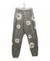 Denim Tears（デニムティアーズ）の古着「Cotton Wreath ドローストリング トラックパンツ」｜グレー