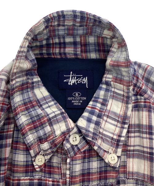 stussy（ステューシー）stussy (ステューシー) パッチワークシャツ ブルー×レッド サイズ:Sの古着・服飾アイテム