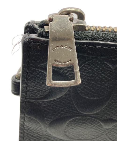 COACH（コーチ）COACH (コーチ) シグネチャーエンボスドクラッチバッグ ブラックの古着・服飾アイテム