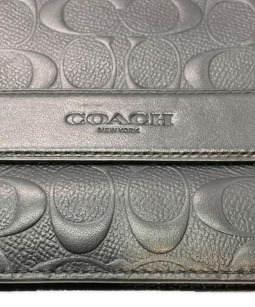 COACH（コーチ）COACH (コーチ) シグネチャーエンボスドクラッチバッグ ブラックの古着・服飾アイテム