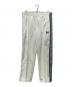 Needles（ニードルズ）の古着「ヒザデルトラックパンツ」｜アイボリー