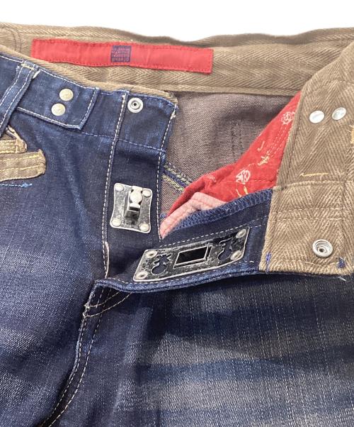 LE JEAN DE MARITHE+FRANCOIS GIRBAUD（マリテフランソワジルボー）LE JEAN DE MARITHE+FRANCOIS GIRBAUD (マリテフランソワジルボー) ターンロックデザインデニムパンツ インディゴ サイズ:SSの古着・服飾アイテム