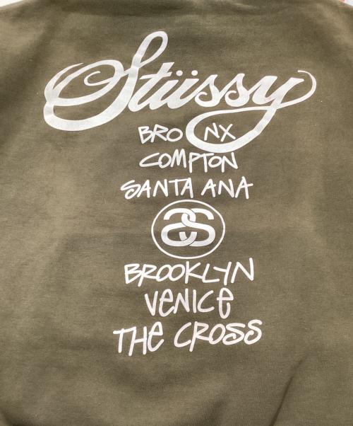 stussy（ステューシー）stussy (ステューシー) 90ｓ WORLD TOURプルオーバーパーカー オリーブ サイズ:Lの古着・服飾アイテム